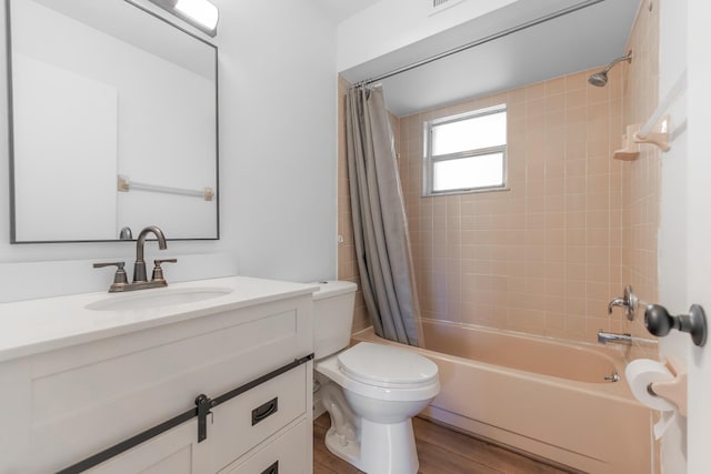full bath with shower / bath combination with curtain, toilet, vanity, and wood finished floors