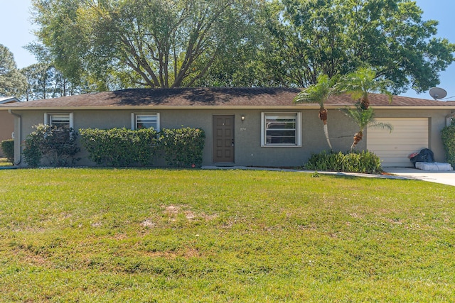 single story home with stucco siding, driveway, a front lawn, and a garage