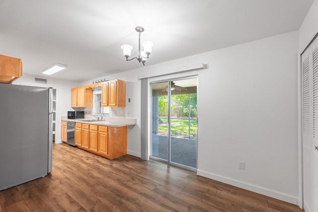 kitchen featuring light countertops, wood finished floors, visible vents, and appliances with stainless steel finishes