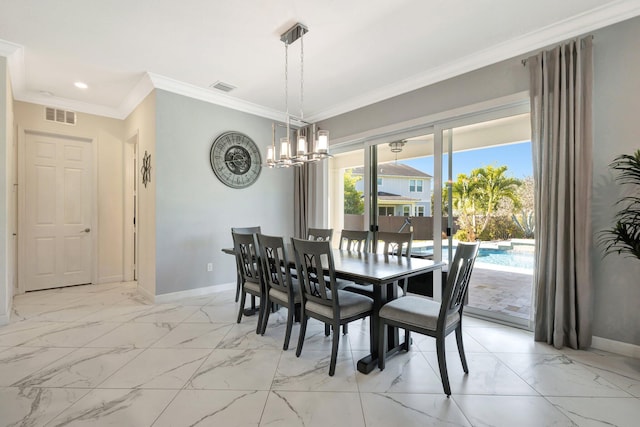 dining room featuring crown molding, baseboards, and visible vents