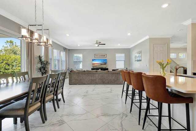 dining area with recessed lighting, crown molding, and ceiling fan