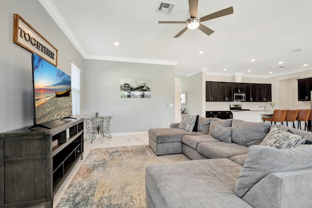 living room with visible vents, crown molding, recessed lighting, marble finish floor, and a ceiling fan