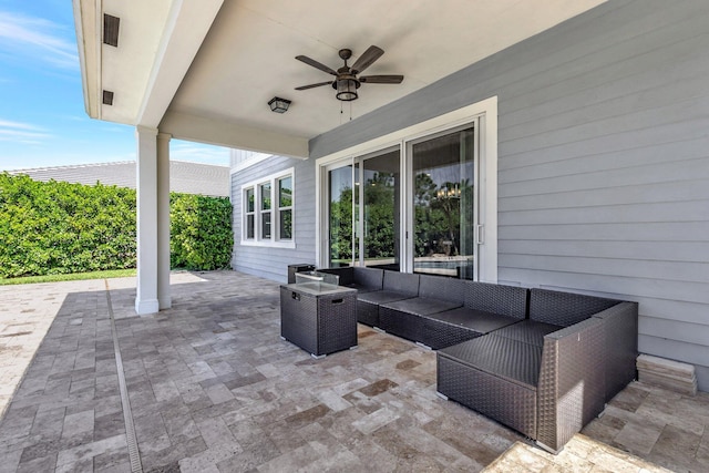 view of patio / terrace with an outdoor living space and a ceiling fan