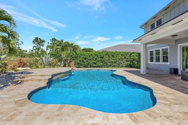 outdoor pool with a patio