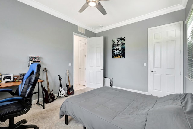 carpeted bedroom featuring visible vents, baseboards, and ornamental molding