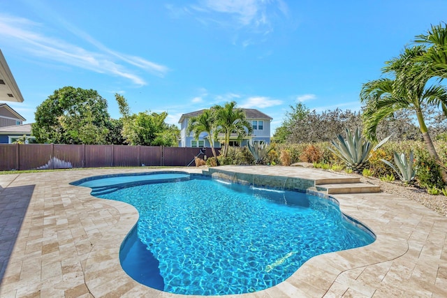 view of swimming pool featuring a fenced in pool, a patio, and a fenced backyard