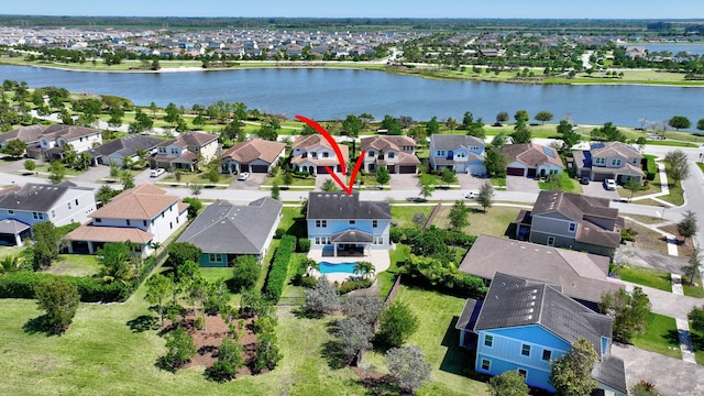 1009 Sterling Pine Pl, Loxahatchee, FL 33470 - drone / aerial view featuring a water view and a residential view