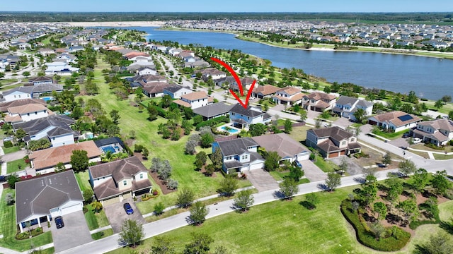 1009 Sterling Pine Pl, Loxahatchee, FL 33470 - aerial view featuring a water view and a residential view