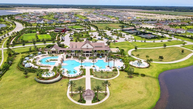 drone / aerial view with a residential view and a water view