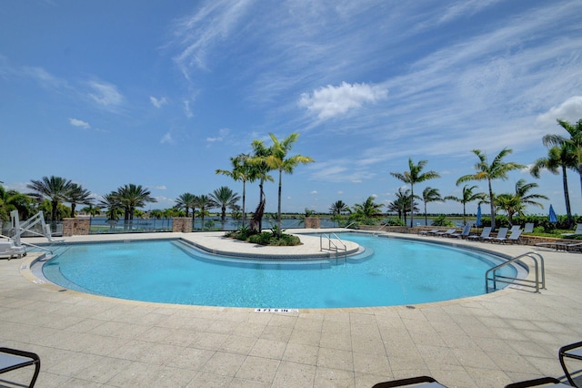 pool featuring a patio and fence