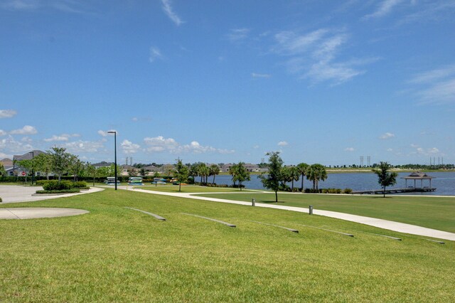 1009 Sterling Pine Pl, Loxahatchee, FL 33470 - view of home's community with a water view and a yard