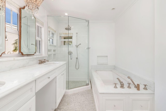 full bathroom featuring a garden tub, a stall shower, ornamental molding, a sink, and double vanity