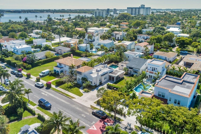 bird's eye view with a water view and a residential view