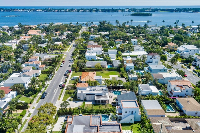 drone / aerial view with a residential view and a water view