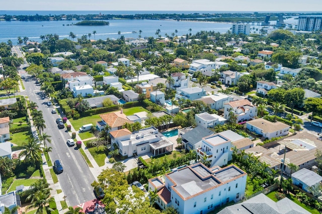 bird's eye view featuring a water view and a residential view