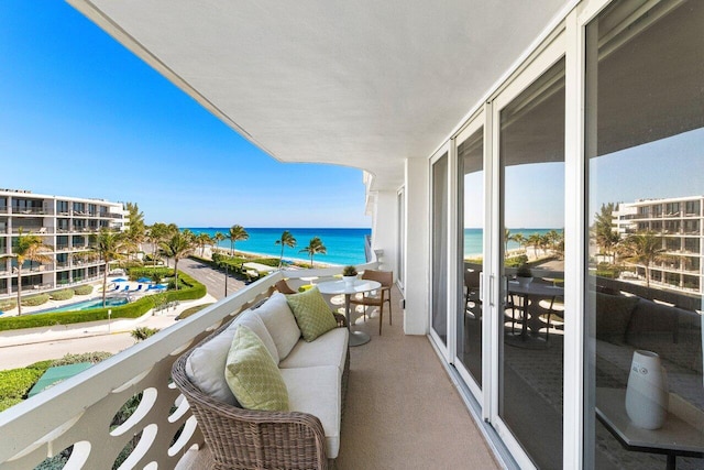 balcony featuring a water view