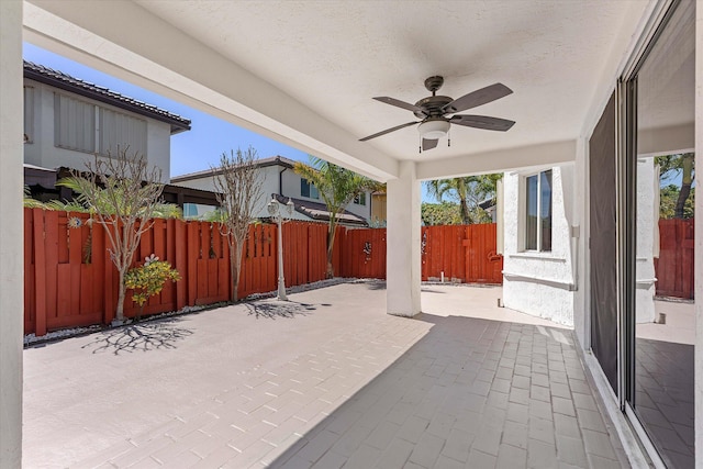 view of patio featuring a fenced backyard and a ceiling fan