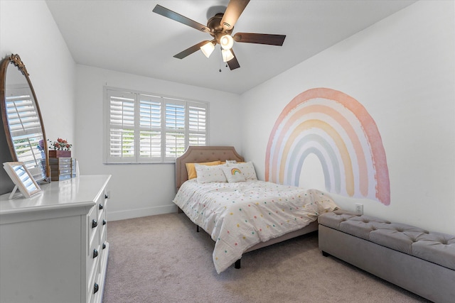 bedroom with baseboards, light colored carpet, and a ceiling fan