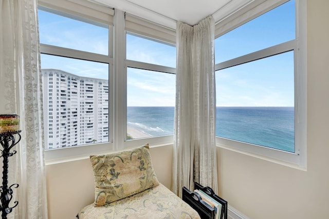 bedroom featuring multiple windows and a water view