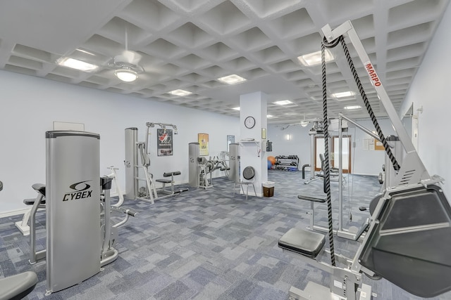 exercise room with a ceiling fan, carpet, and coffered ceiling