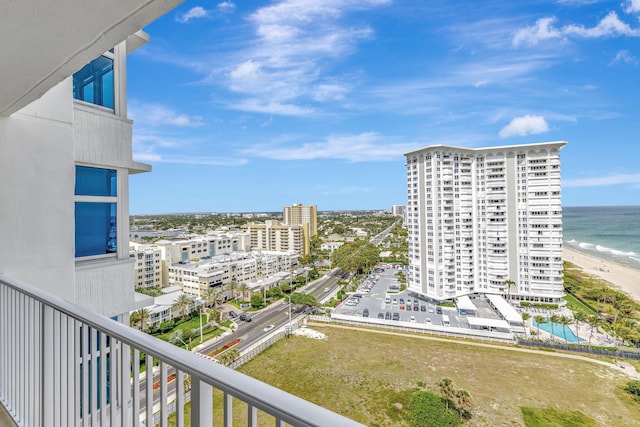 balcony with a view of city and a water view