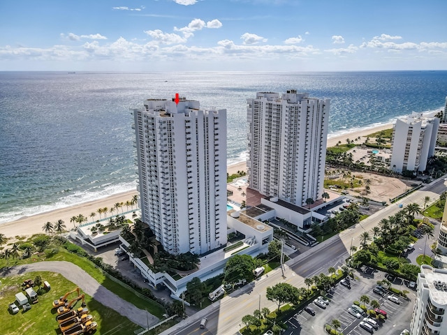 aerial view with a water view, a view of city, and a view of the beach