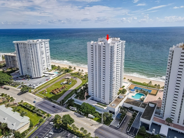 bird's eye view with a water view and a view of the beach