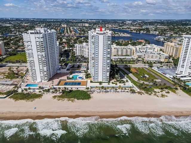 bird's eye view with a view of city, a view of the beach, and a water view