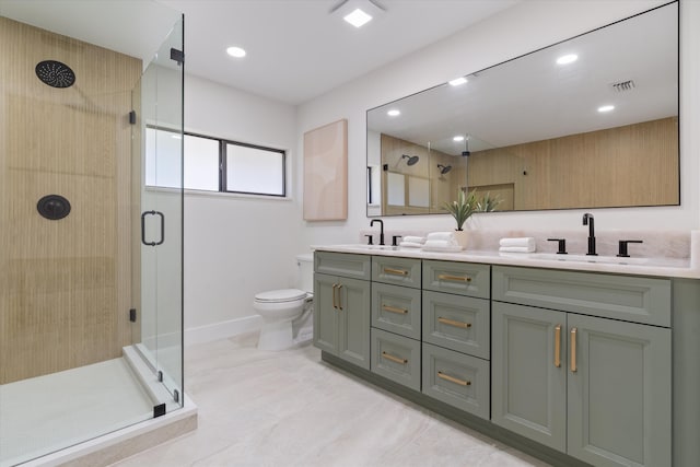 full bathroom with a shower stall, toilet, double vanity, and a sink