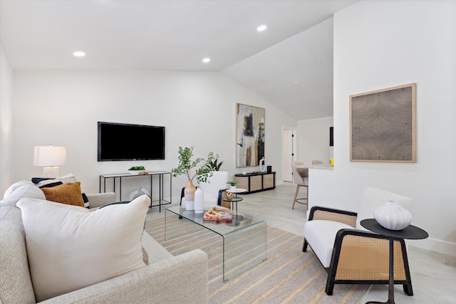 living room with recessed lighting, baseboards, and vaulted ceiling