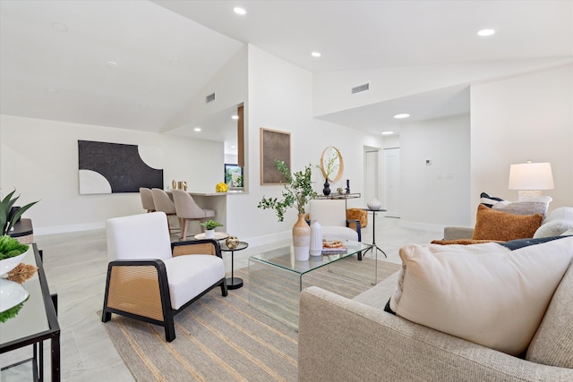 living room featuring recessed lighting, visible vents, and baseboards