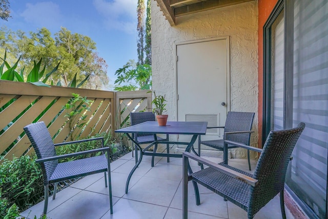 balcony featuring visible vents and outdoor dining area