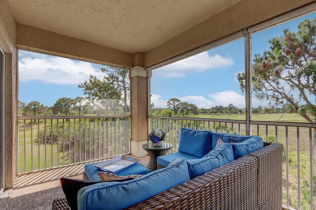 8290 Mulligan Cir Unit 2421, Port Saint Lucie, FL 34986 - sunroom with an outdoor hangout area and plenty of natural light
