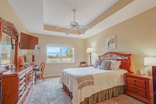 8290 Mulligan Cir Unit 2421, Port Saint Lucie, FL 34986 - bedroom featuring light carpet, multiple windows, baseboards, and a raised ceiling