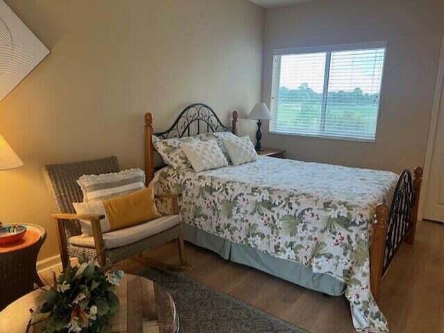 8290 Mulligan Cir Unit 2421, Port Saint Lucie, FL 34986 - bedroom featuring wood finished floors