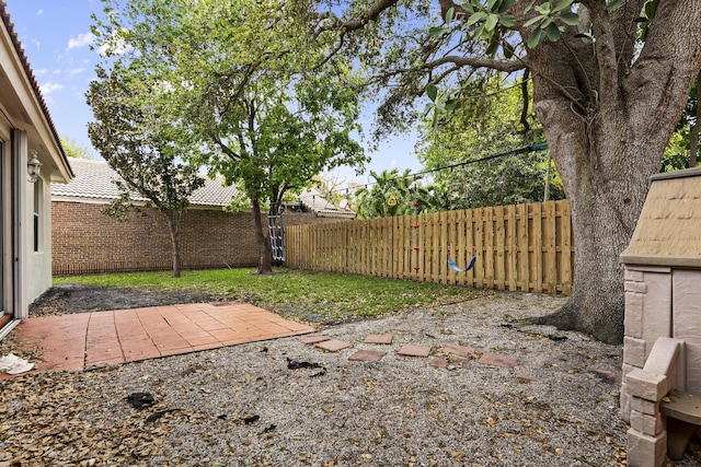 view of yard with a patio and a fenced backyard