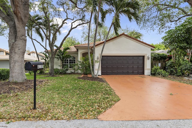 view of front facade featuring a front lawn, a tile roof, stucco siding, a garage, and driveway