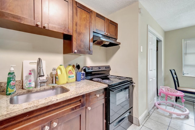 kitchen featuring light tile patterned floors, a sink, black range with electric stovetop, under cabinet range hood, and a textured ceiling