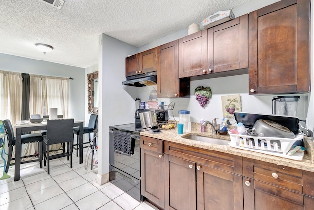 kitchen featuring light tile patterned floors, light stone counters, a sink, under cabinet range hood, and black electric range oven