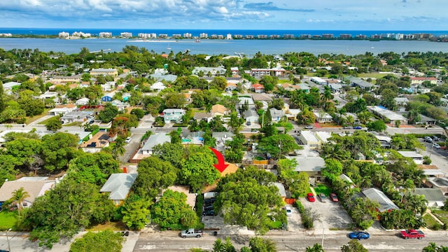 bird's eye view with a water view and a residential view