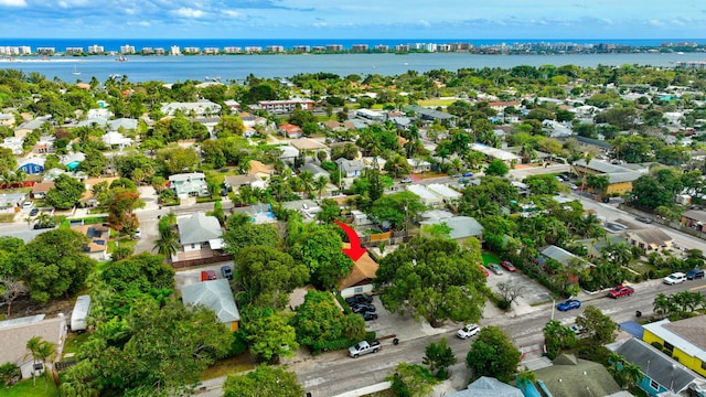 birds eye view of property with a residential view and a water view