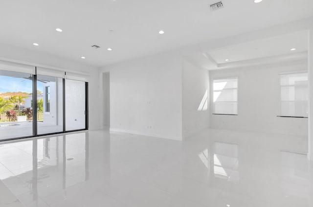 spare room with recessed lighting and visible vents