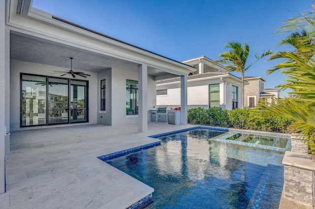 view of pool featuring area for grilling, a pool with connected hot tub, a ceiling fan, and a patio