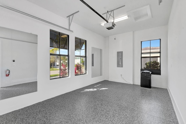 unfurnished room with electric panel and speckled floor