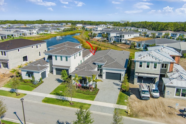 aerial view with a residential view and a water view