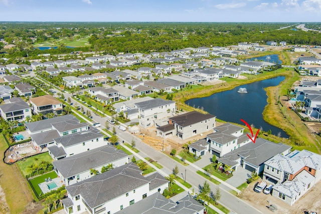 birds eye view of property featuring a residential view and a water view