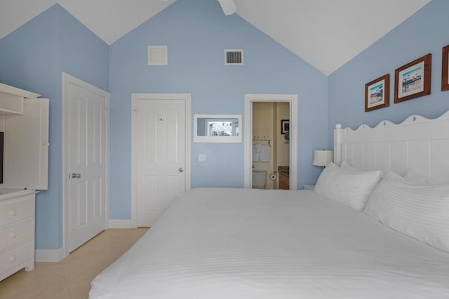 bedroom with light tile patterned flooring, visible vents, ensuite bath, and baseboards