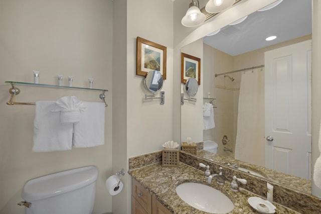 bathroom with a shower with shower curtain, toilet, and vanity