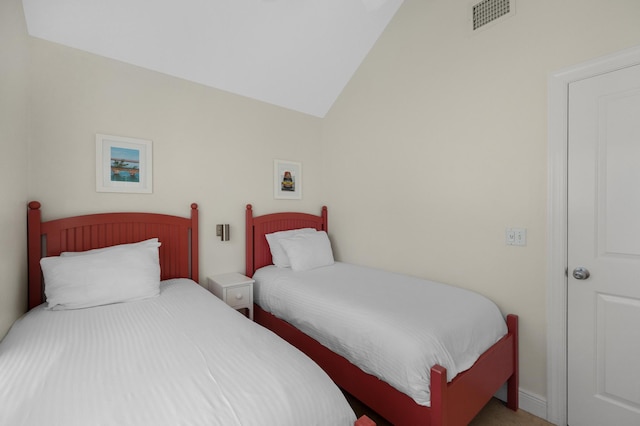 bedroom featuring visible vents and lofted ceiling