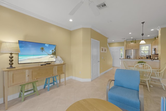 living room with visible vents, crown molding, baseboards, light tile patterned floors, and recessed lighting